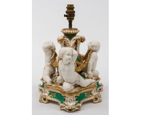 A Minton & Co. porcelain and parian mounted table centrepiece, converted as a lamp: modelled with three naked putti bound by 