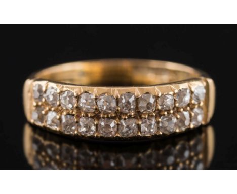 A gold and diamond two row ring: set with old-cut diamonds, approximately 0.3ct total diamond weight, ring size J. 