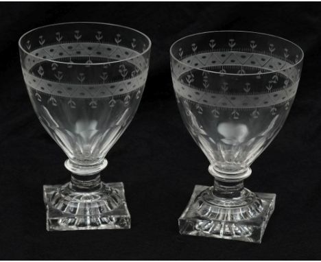 A pair of rummers: the bowls engraved with a simple foliate and zig-zag band above basal slice cutting on a short knopped ste