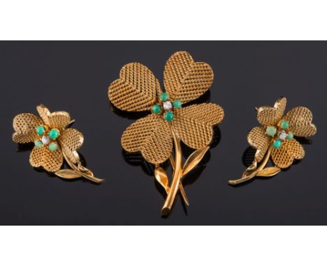 A gold, turquoise and diamond mounted 'four leaf clover' brooch: of rope-twist design set with a central, circular, brilliant