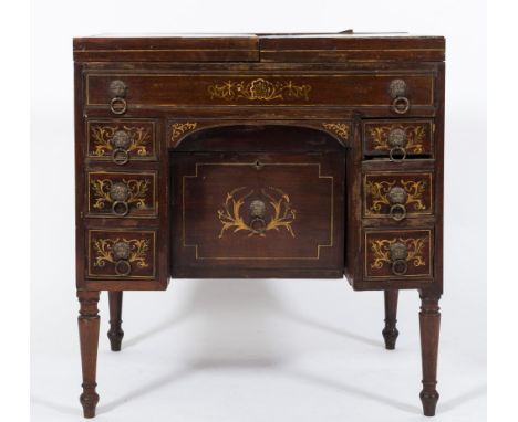 An early 19th Century mahogany, inlaid and decorated enclosed washstand:, bordered with boxwood lines, the hinged top with Ne