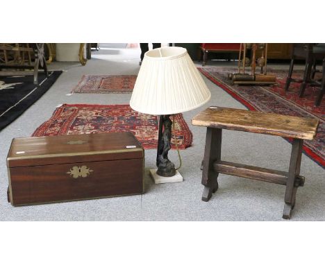 A Regency Mahogany Brass Bound Campaign Writing Slope, 53cm by 28cm by 20cm; together with a rustic stool and a figural spelt