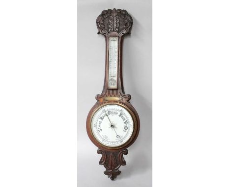 A Victorian Aneroid Barometer/Thermometer, in an oak banjo case set with a presentation plaque.Case with applied presentation