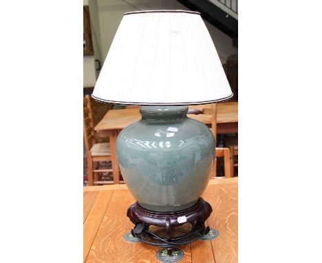 A Modern Chinese Porcelain Crackle Celadan Glazed Table Lamp, on hardwood base and with pleated shade, 80cm overall