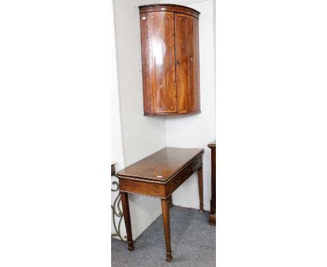 An Early 19th-century Mahogany Fold Over Card Table, with single drawer and on reeded square supports, 91cm by 45cm by 73cm; 