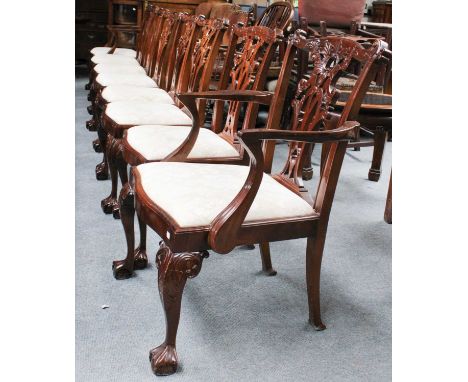 A Set of Eight Reproduction Carved Mahogany Dining Chairs, in Chippendale style, comprising two carver chairs and six side ch