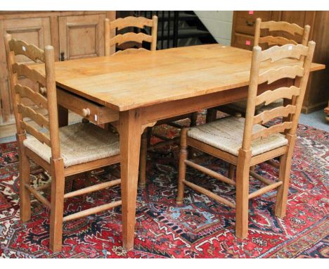 A Light Oak Two Drawer Kitchen Table, 153cm by 89cm by 77cm ; together with four ladder back rush seated chairs (5)