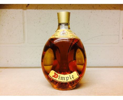DIMPLE
Blended Scotch Whisky. 
26 2/3 fl.oz, 70° proof.  CONDITION REPORT: Slight peeling to edges of label, otherwise good. 