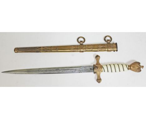 A German WWII Third Reich Kriegsmarine dagger, wire bound plastic grip with gilt brass swastika and eagle pommel, gilt brass 