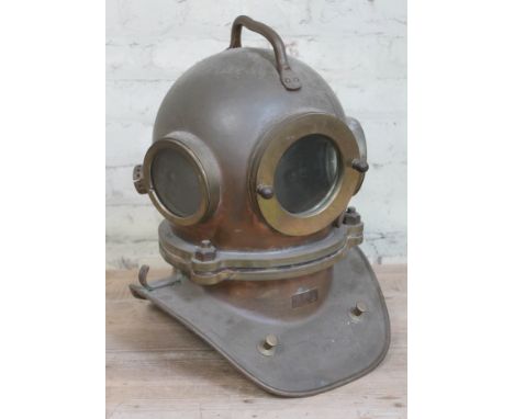 A copper and brass deep sea diver's helmet, height 48cm.&nbsp;Condition - generally appears good, however we're not sure if i