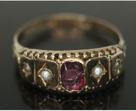 A Victorian hallmarked 9ct gold ring set with pink paste and split pearls, gross wt. 1.84g, size R.  