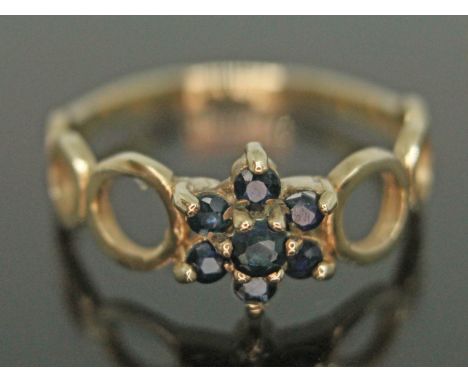 A hallmarked 9ct gold sapphire cluster ring, gross wt. 1.88g, size O.  