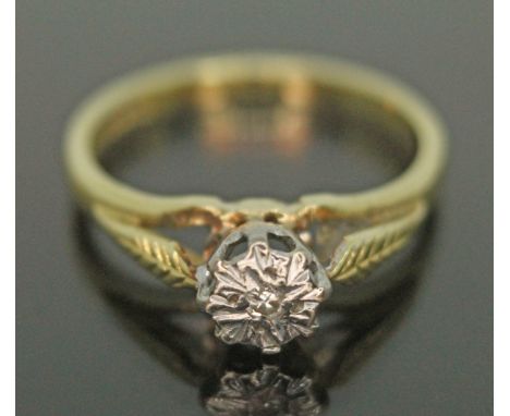 A hallmarked 18ct gold ring with single diamond in illusion setting, gross wt. 2.44g, size I.  