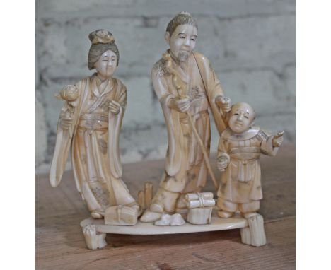 A Japanese carved ivory okimono, meiji period, height 17cm.&nbsp;Condition - all three figures appear to be missing an item f