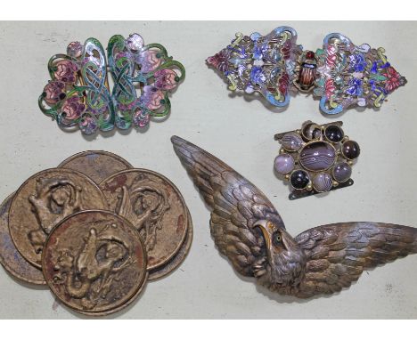 A group of four belt buckles including two Art Nouveau gilt metal and enamel, an eagle and another set with onyx cabochons, t