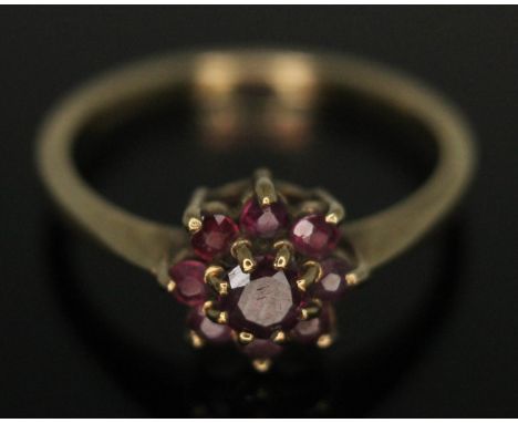 A hallmarked 9ct gold ruby cluster ring, head diam. approx. 7mm, gross wt. 1.93g, size N.  