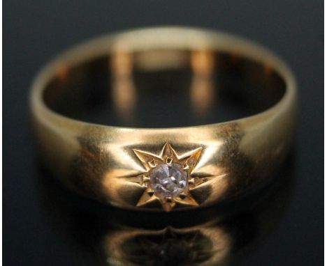 A single stone diamond ring, band marked '18ct', gross wt. 2.65g, size K.  