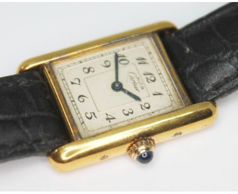 A Cartier Tank silver gilt wristwatch.&nbsp;Case width 20mm (excluding crown) and length 28mm. Condition - not currently runn