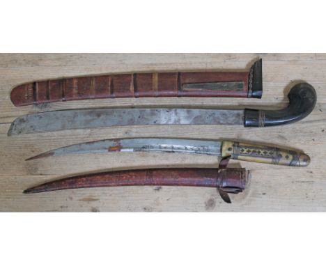 A North African short sword with horn handle and leather scabbard length 53cm and an eastern short sword/machete with horn ha