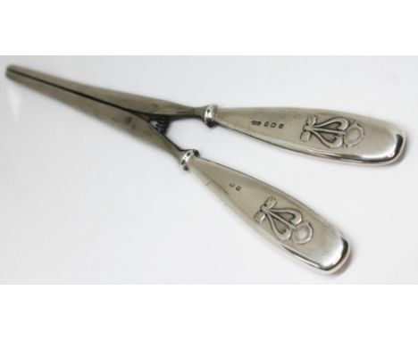 A pair of Edwardian Art Nouveau style silver handled glove stretchers, Liberty &amp; Co, Birmingham 1907, length 19.5cm.  