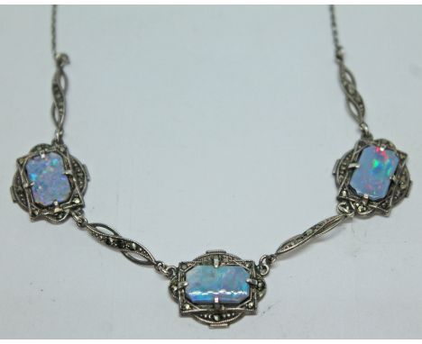 A white metal necklace set with opal triplet panels and marcasites, length 41cm.  