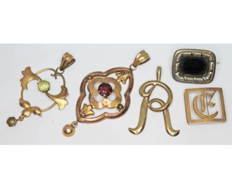 Two Edwardian pendants, each set with coloured paste and both marked '9ct', lengths 37cm &amp; 45mm, wt. 2.50g, together with