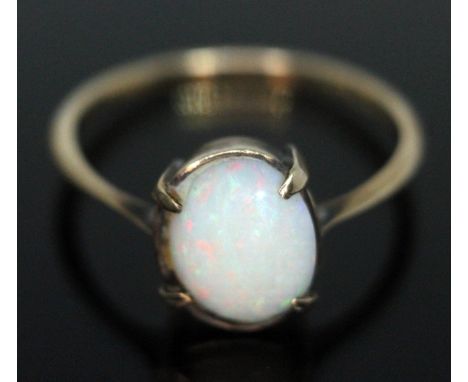 A precious opal cabochon ring, marked '9ct', gross wt. 1.94g.  