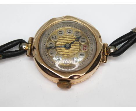 A ladies Art Deco wrist watch, marked '9ct', with leather strap, case diam. 25mm.  