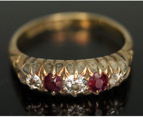 A diamond and ruby ring, band marked '18ct', gross wt. 4.18g, size P.