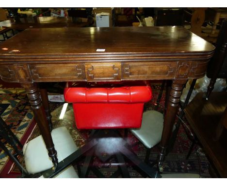 A Regency mahogany round cornered fold-over card table, raised on ring turned slightly tapering supports, w.91cm 