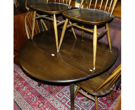 An Ercol dark elm drop leaf kitchen table, with four stickback chairs (5)