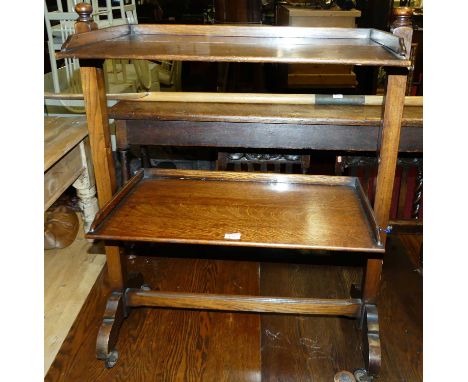 1973A 1930s oak two-tier folding tea trolley, on roller castors, w.68.5cm