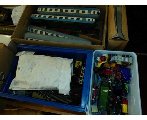 Four boxes containing mixed 0 gauge rolling stock, one box of mixed diecast to include Dinky, and one box of modern issue die