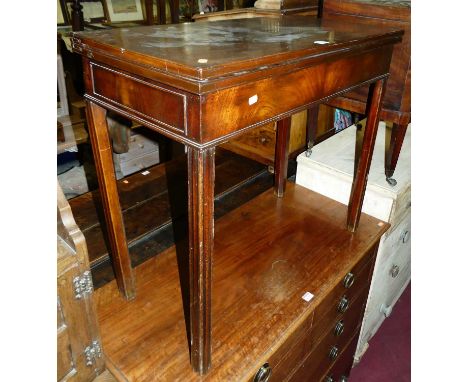 An early 19th century mahogany fold-over card table, having a baize lined interior, raised on chamfered square supports, w.84