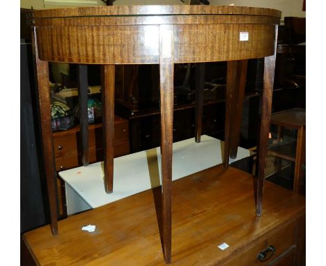 A 19th century mahogany demi lune fold over card table, with baize lined interior, width 91cm