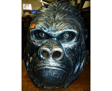A contemporary silvered ceramic gorilla's head