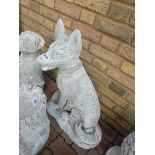 Large concrete sitting canine