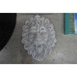 Large concrete lion's head wall plaque