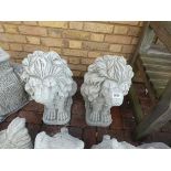 Large pair of concrete sitting lions