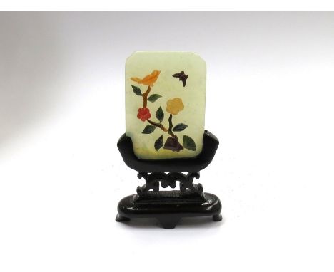 A small jade panel with blossoming branch, bird and butterfly, on stand 5cm x 3.5cm 