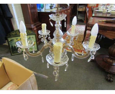 A five arm chandelier with cut glass bowls, stem and plastic armatures 