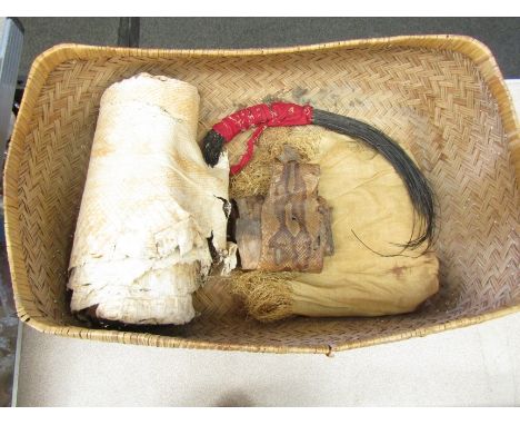 An African possibly Gabonese, woven basket together with a fabric square with fringing, an elephant hair fly whisk and two sn