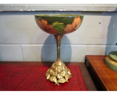 A vintage Moorcroft tazza centrepiece, green hibiscus pattern, 32cm high, a/f - crack to bowl, gilt loss 