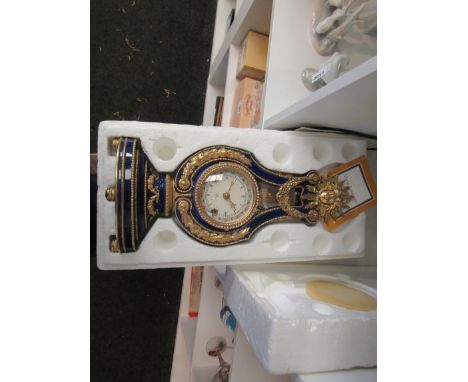 A Frankin Mint "Marie Antoinette" Flowers of Versailles porcelain cased mantel clock.  39cm height 