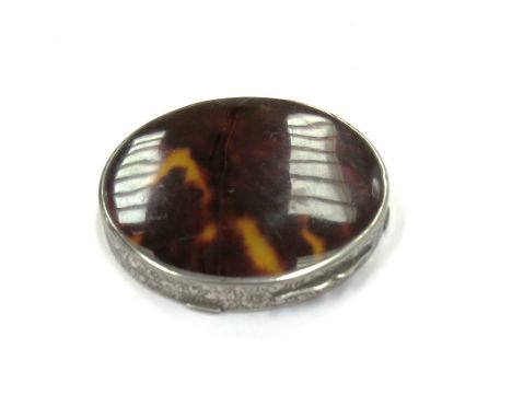 A tortoiseshell circular powder/mirror compact with foliate scroll decoration to edge, engine turned back, stamped 800 