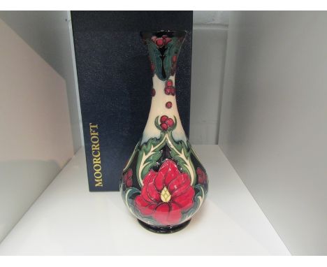 A Moorcroft Ruby pattern vase designed and signed by Rachel Bishop, No.105, 23cm tall, boxed 