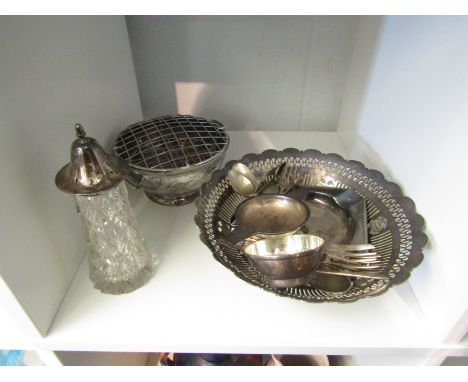 An Elkington silver tea strainer, a glass sugar castor with silver rim and lid and a selection of plated wares including rose