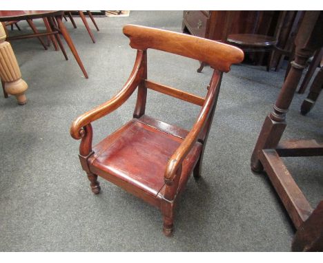 An apprentice style/child's commode chair with scroll arms. 50cm high 