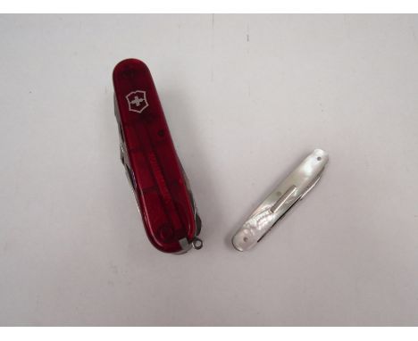 A Victorinox Swiss army knife and a mother-of-pearl handled penknife (2) 