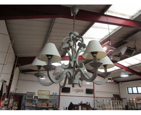 A six arm modern ceiling light with shades 
